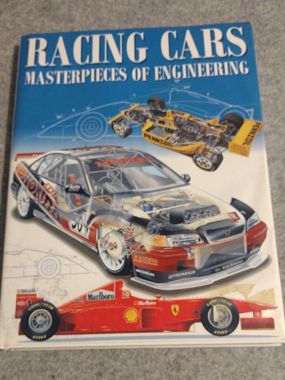 Racing Cars: Masterpieces of Engineering – Blue & Red Cover Book